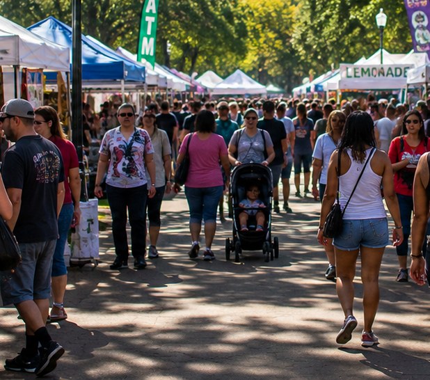 Families walking through a vendor market