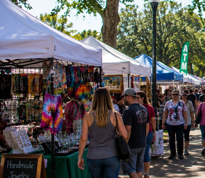 Outdoor craft fair booths with visitors